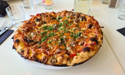 pizza atop white plate and table