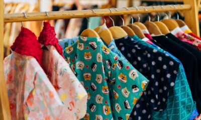 assorted and colored clothes on a rack