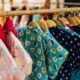 assorted and colored clothes on a rack