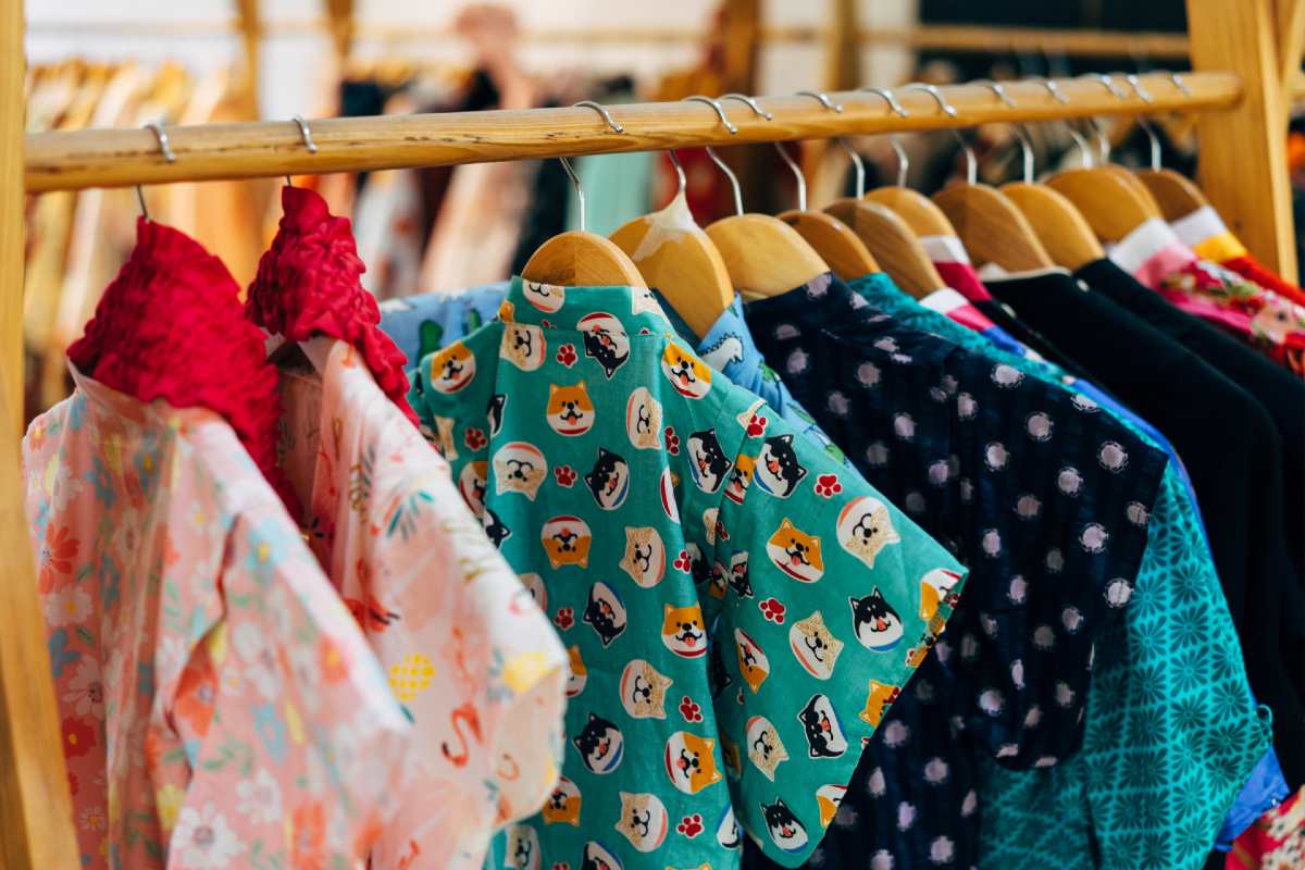 assorted and colored clothes on a rack