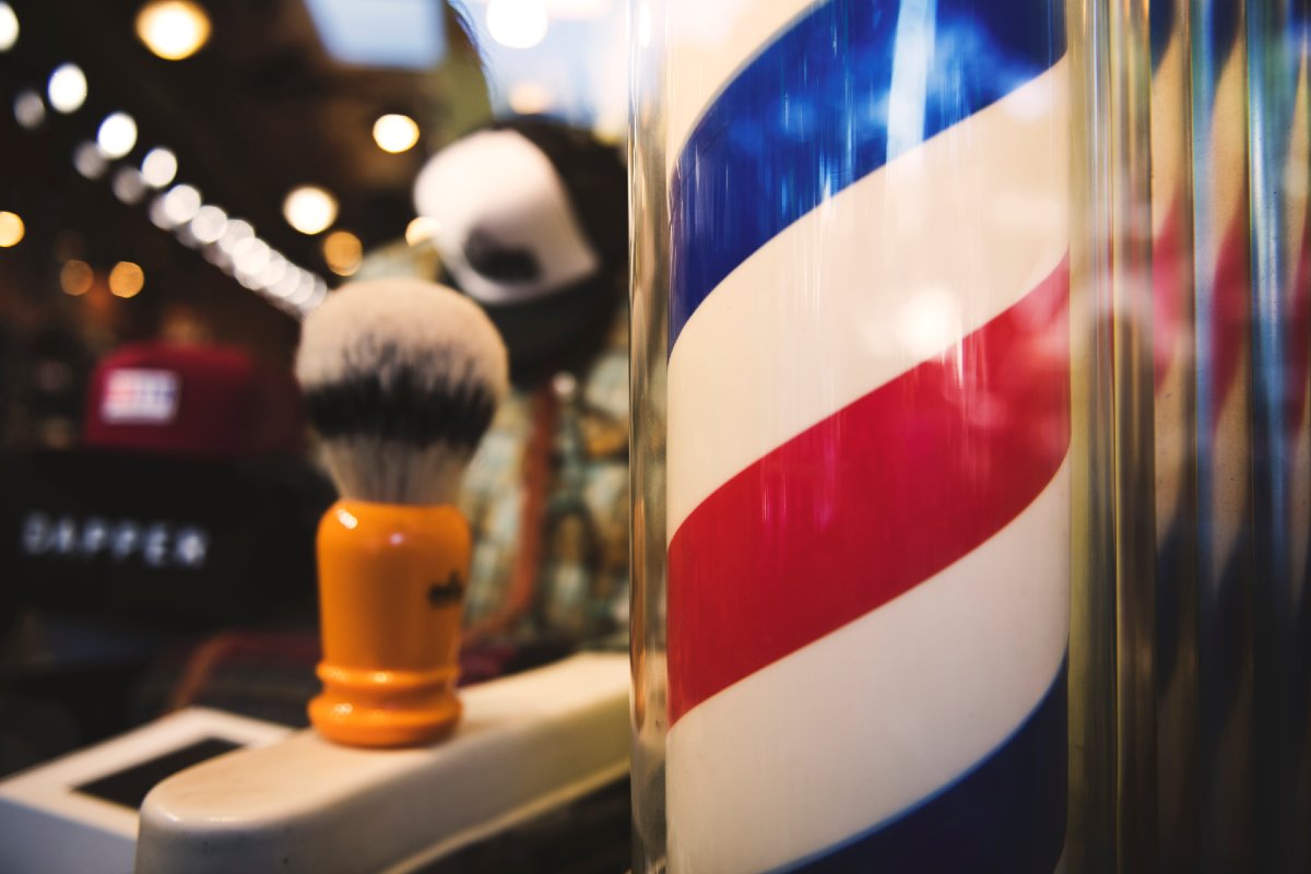 red blue and white barberpole and brush