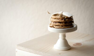 stacked cookies with white ribbon on a saucer