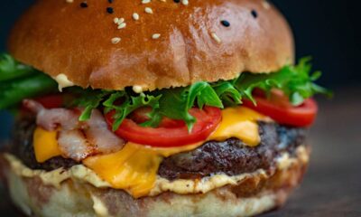 close up photo of hamburger with lettuce tomato bacon and cheese