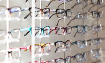 different colored eyeglasses on display