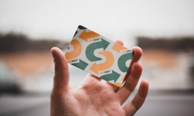 hand holding a subway card