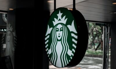 starbucks logo hanging outside the store