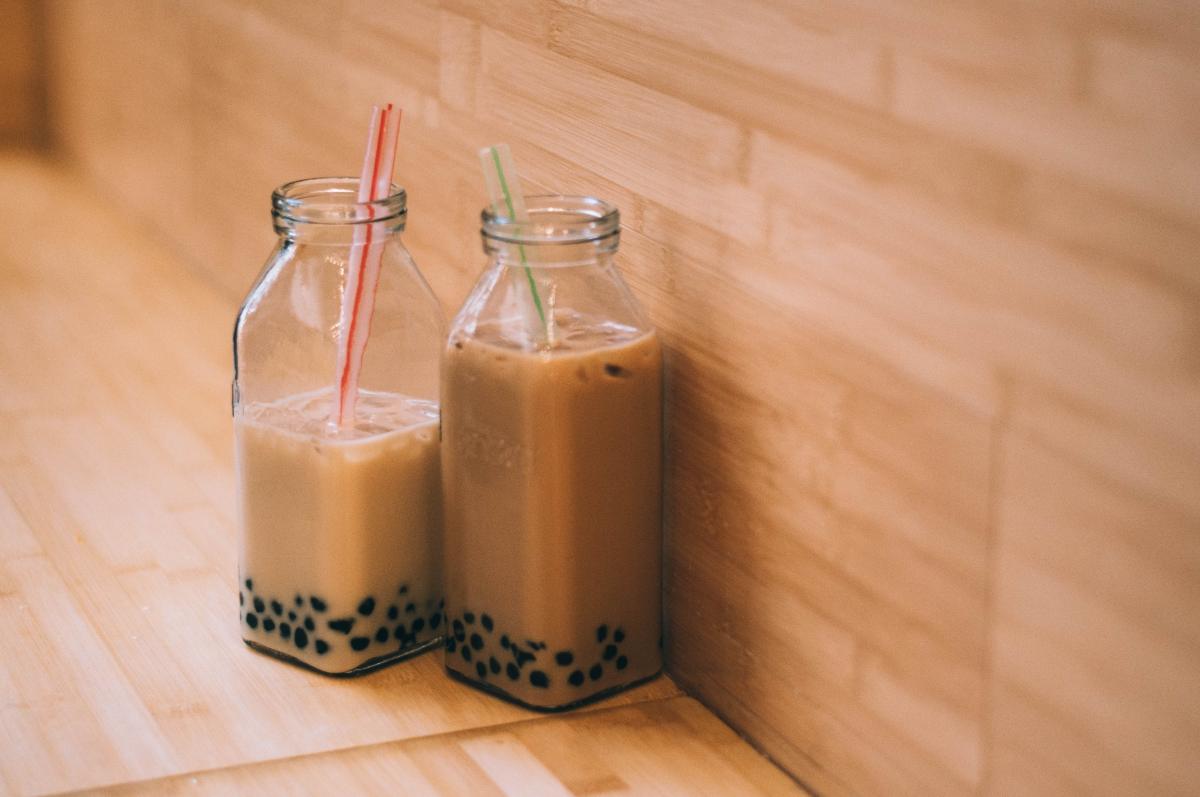 two bottles of bubble tea with straws