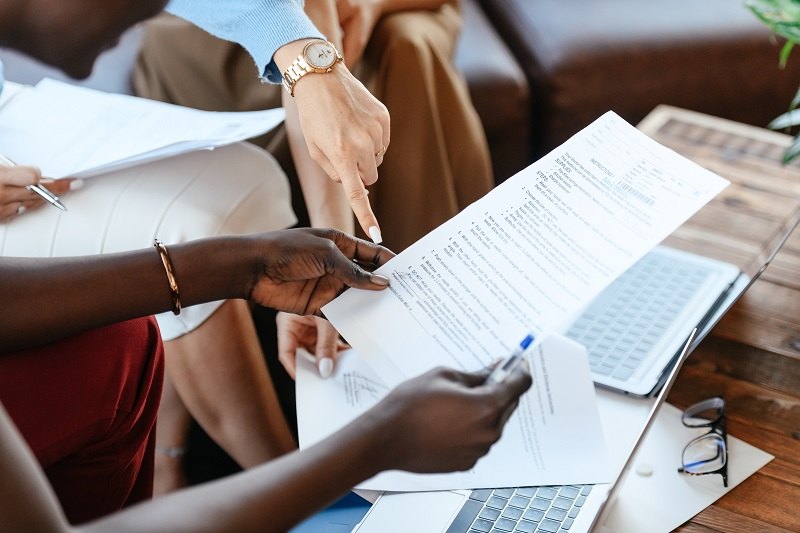 people looking at one document