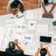 people working near a desk