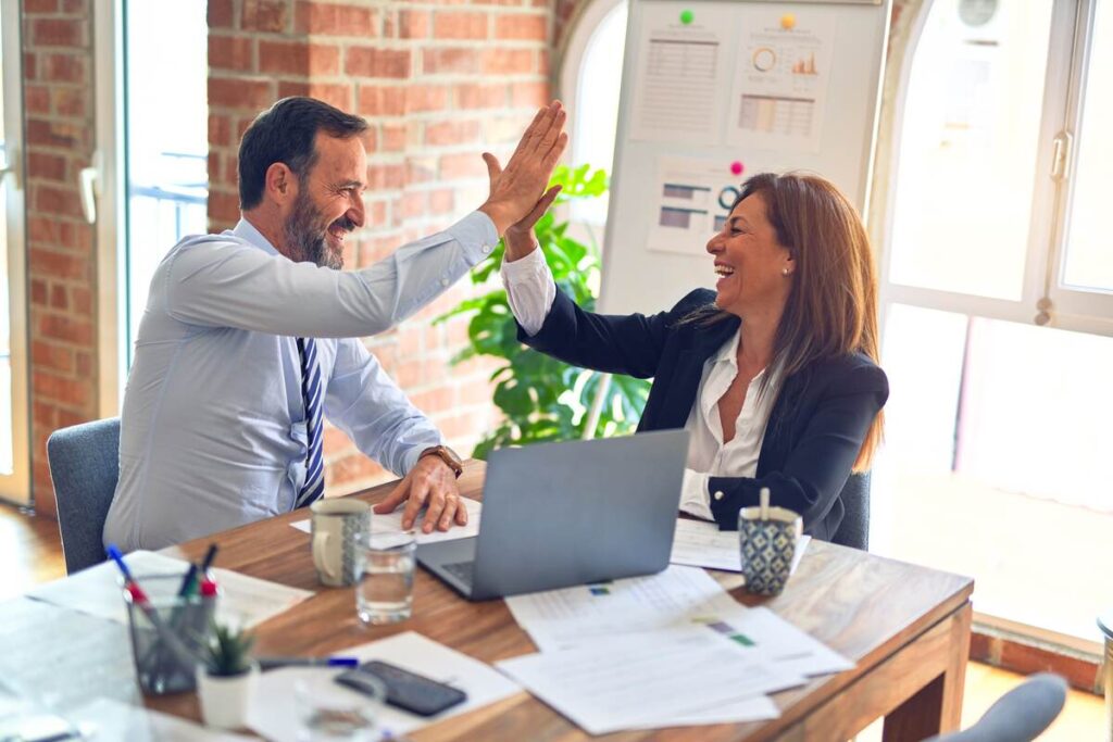 two people high fiving