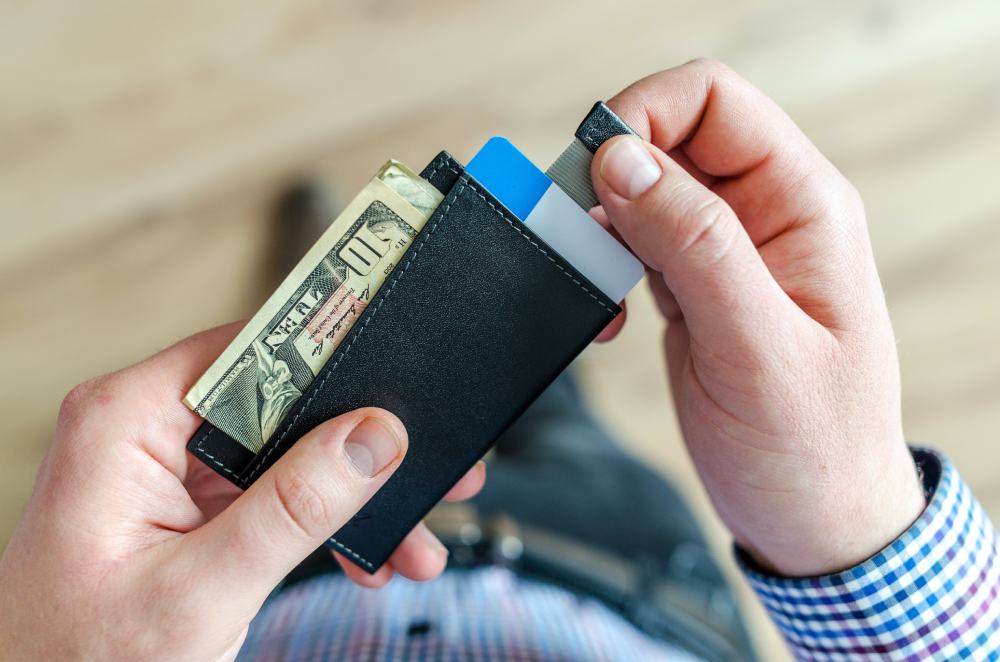 person holding their wallet