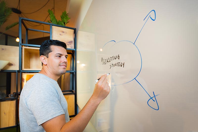 man using whiteboard