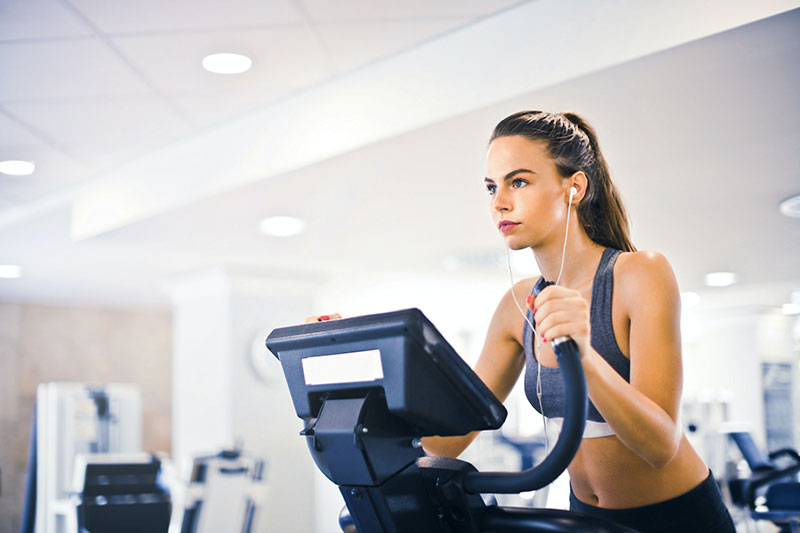 woman using an exercise machine