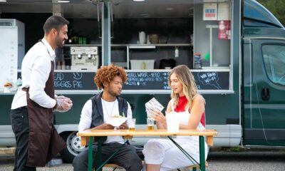 food truck and three people