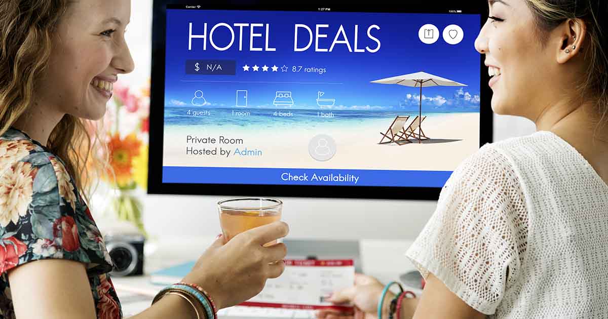 two women looking at hotel deals